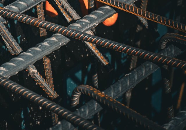 Close-up of bent reinforcing bar tied into a cage