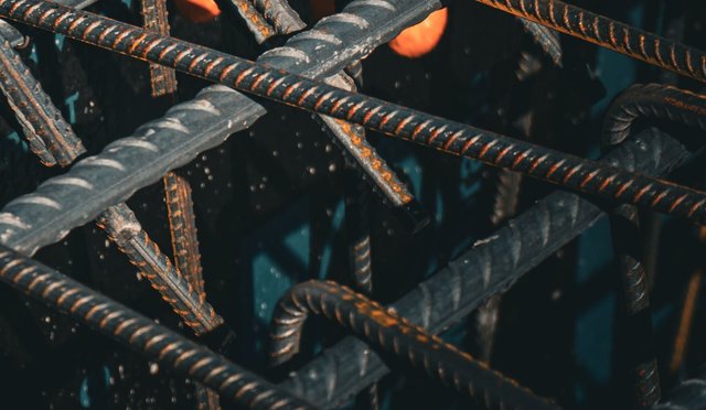 Close-up of bent reinforcing bar tied into a cage